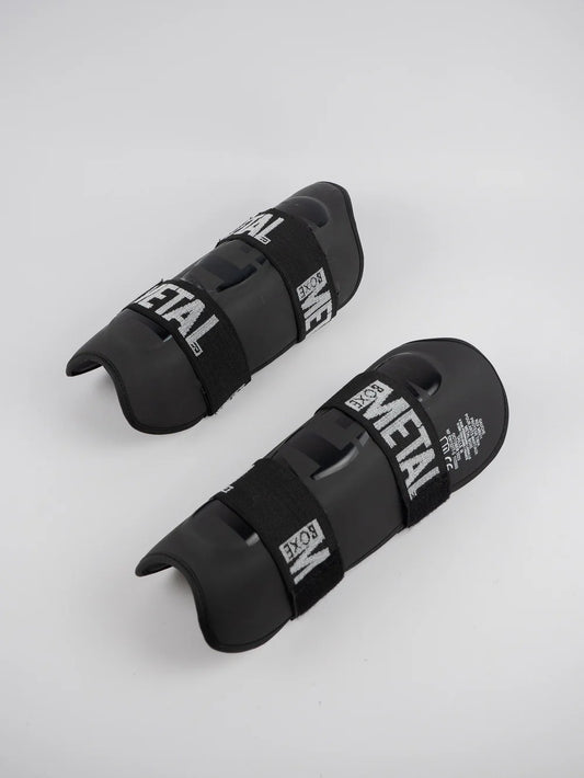 PROTEGE TIBIA PRO. NOIR METAL BOXE