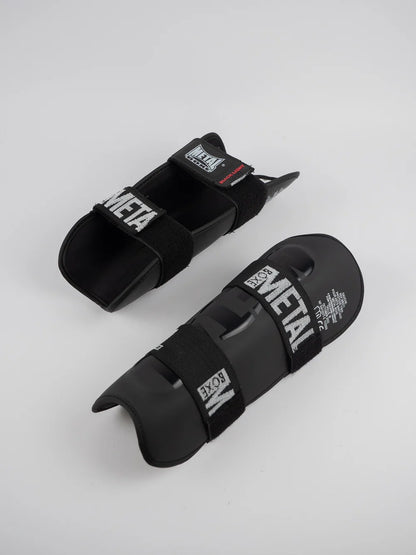 PROTEGE TIBIA PRO. NOIR METAL BOXE