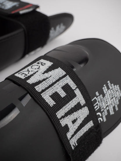 PROTEGE TIBIA PRO. NOIR METAL BOXE