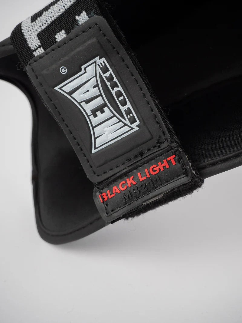 PROTEGE TIBIA PRO. NOIR METAL BOXE