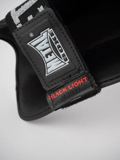 PROTEGE TIBIA PRO. NOIR METAL BOXE